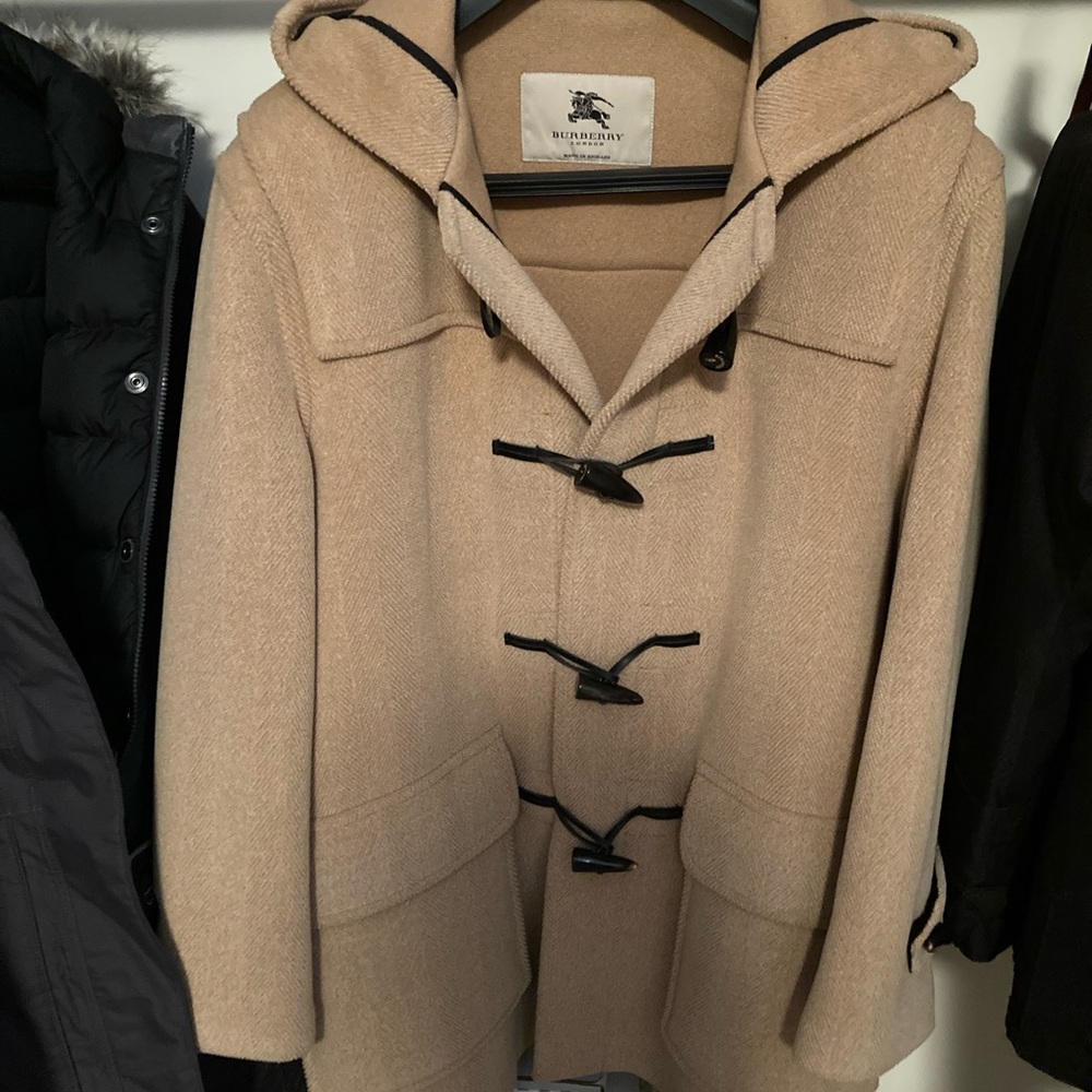 Burberry coat. Never worn. Paid $1400 new for it.